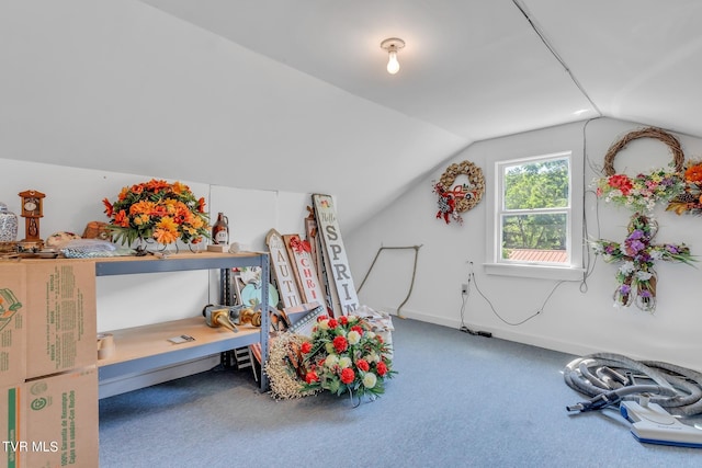 interior space with carpet floors and lofted ceiling