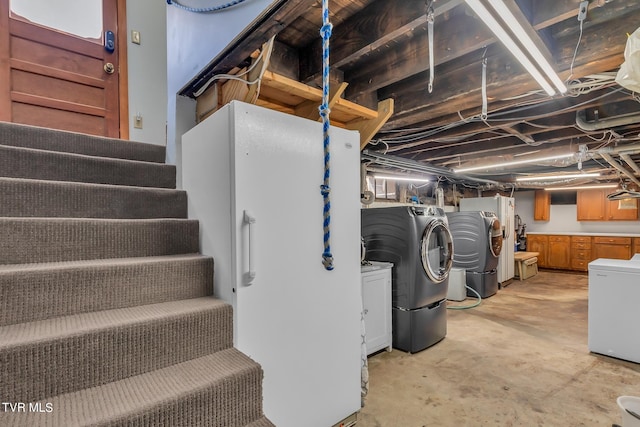 basement with washing machine and clothes dryer