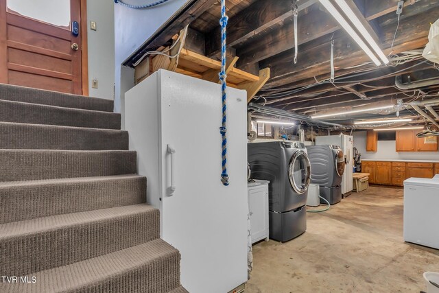 308 E Pearl Ave, Big Stone Gap, VA 24219 - unfinished basement featuring stairs, washer and clothes dryer, and fridge