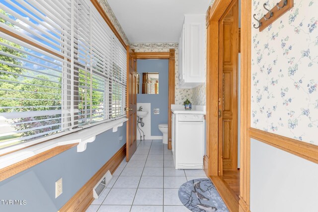 308 E Pearl Ave, Big Stone Gap, VA 24219 - corridor with wallpapered walls and light tile patterned flooring