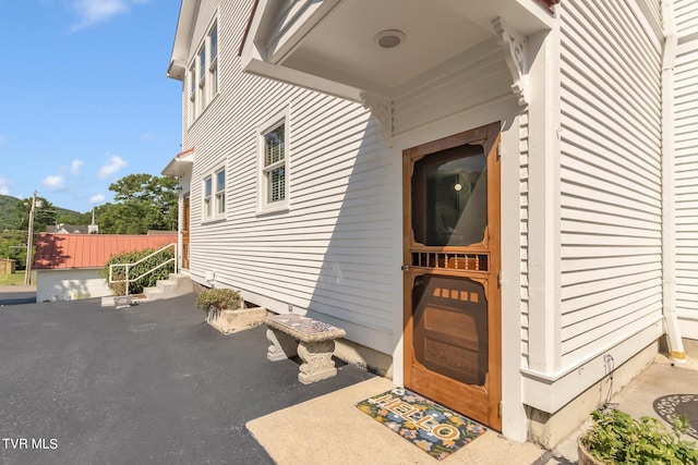 property entrance with a patio area