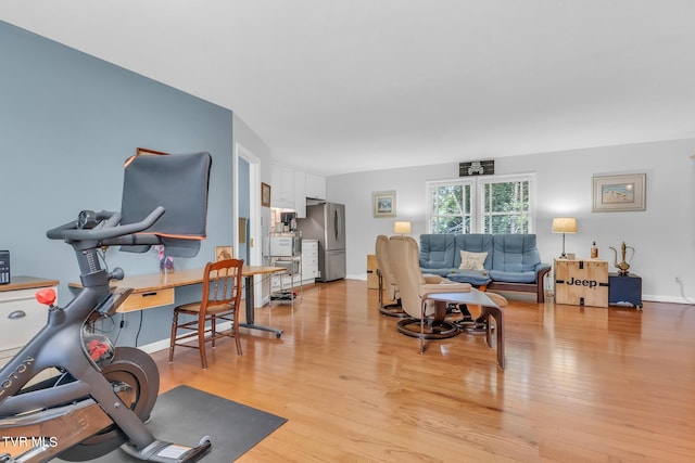 exercise area with light wood-type flooring