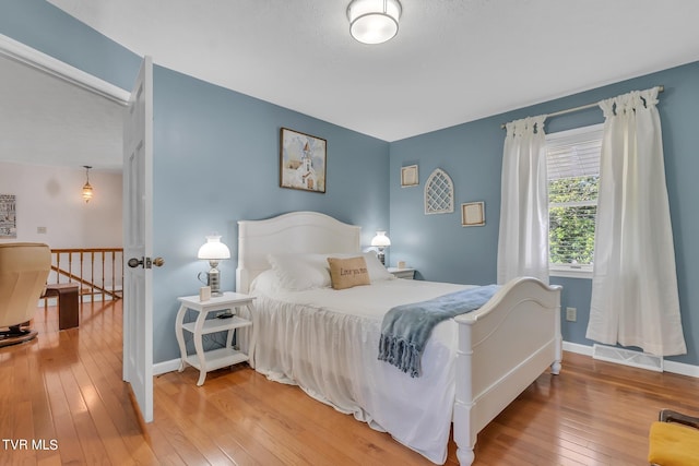 bedroom with wood-type flooring