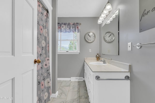 bathroom featuring oversized vanity and tile floors