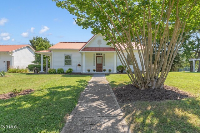 308 E Pearl Ave, Big Stone Gap, VA 24219 - view of front of property featuring a front lawn, a porch, and a metal roof