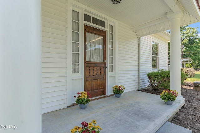 doorway to property featuring covered porch