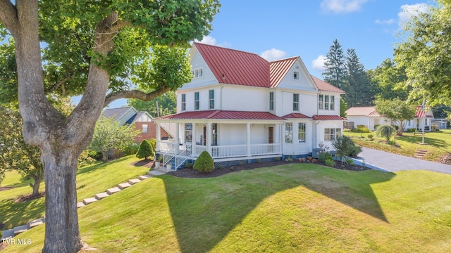 view of front of house with a front lawn and a porch