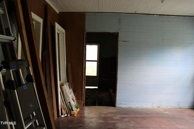 interior space featuring wood walls