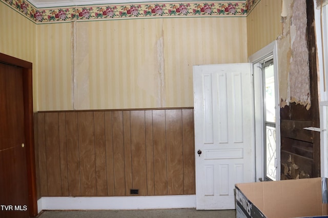 interior space featuring wooden walls