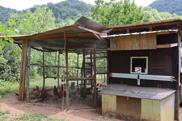 view of home's community featuring an outbuilding