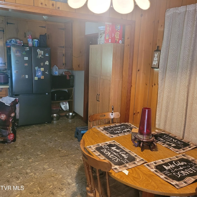 dining area with wood walls