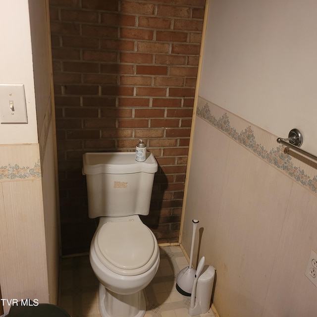 bathroom with tile patterned floors and toilet