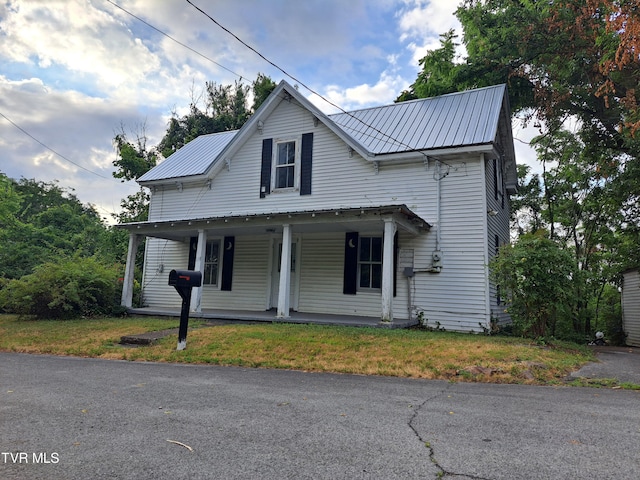 view of front of home featuring a front yard and a porch