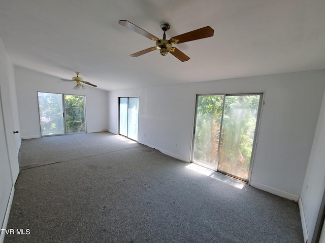 spare room featuring carpet floors and ceiling fan