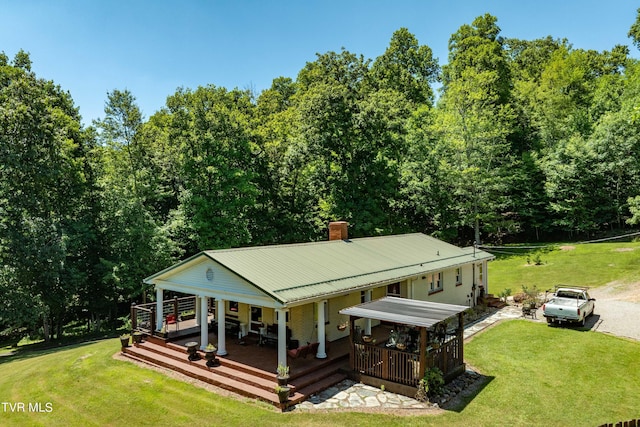 exterior space with a lawn and a porch