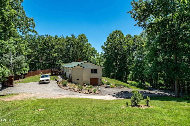 view of yard with a garage