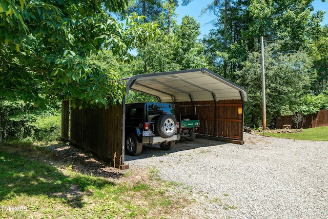 view of vehicle parking with a carport