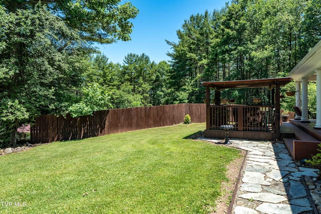 view of yard featuring a deck