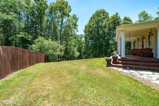 view of yard featuring covered porch