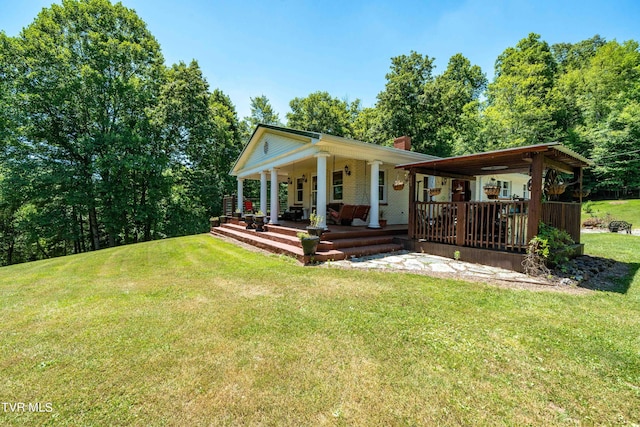 view of front of property with a porch and a front yard