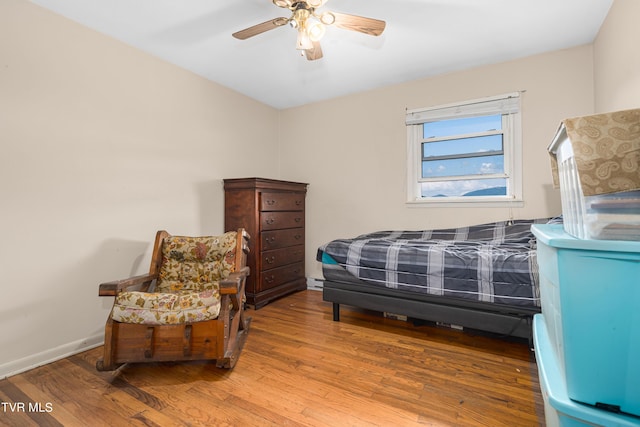 bedroom featuring ceiling fan and wood-type flooring