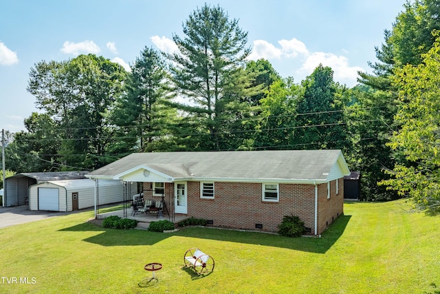 ranch-style house with an outbuilding, a front lawn, and a garage