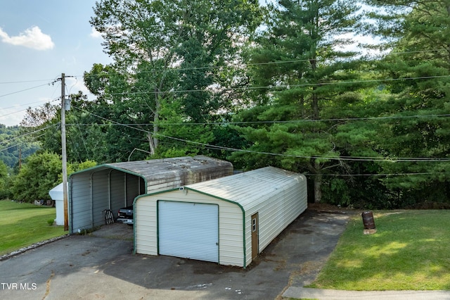 garage featuring a lawn and a carport