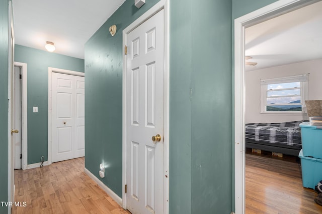 hallway with light wood-type flooring