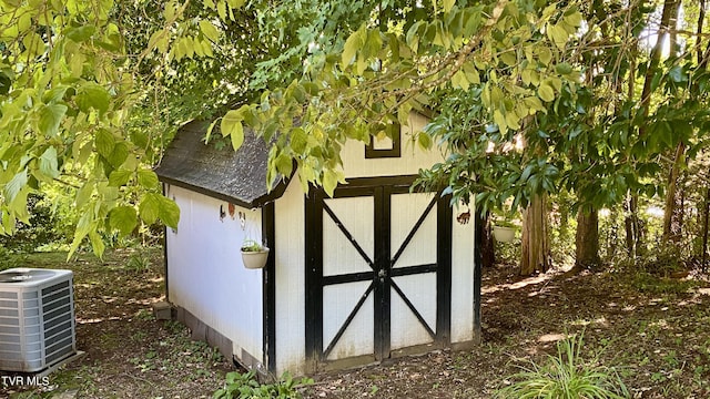 view of outdoor structure featuring central air condition unit