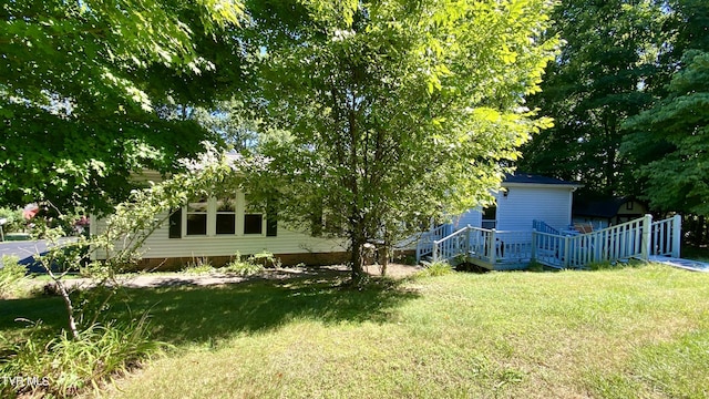 view of yard with a wooden deck