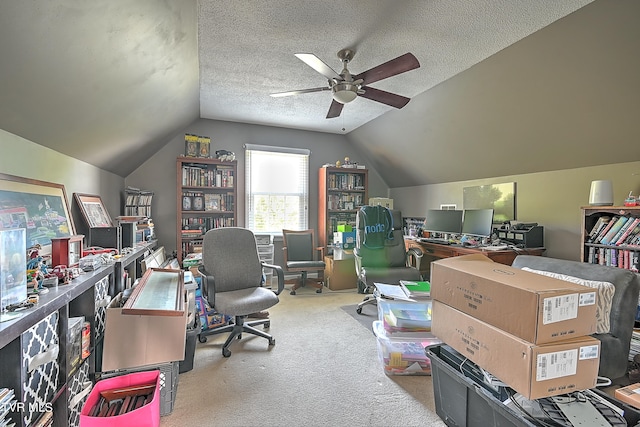 office area featuring a textured ceiling, light colored carpet, vaulted ceiling, and ceiling fan