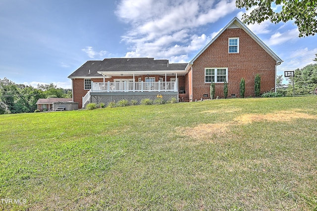 back of house featuring a lawn