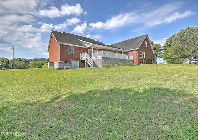 exterior space with a yard and a wooden deck