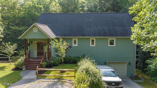 view of front of home featuring a garage and a front lawn