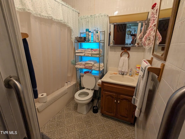 full bathroom featuring tile patterned floors, toilet, vanity, and shower / tub combo