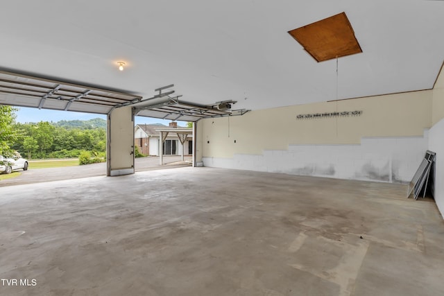3054 Redbud Hwy, Honaker, VA 24260 - garage featuring a garage door opener and concrete block wall