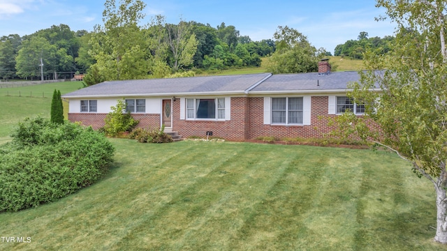 3054 Redbud Hwy, Honaker, VA 24260 - ranch-style home with brick siding, a front yard, and a chimney