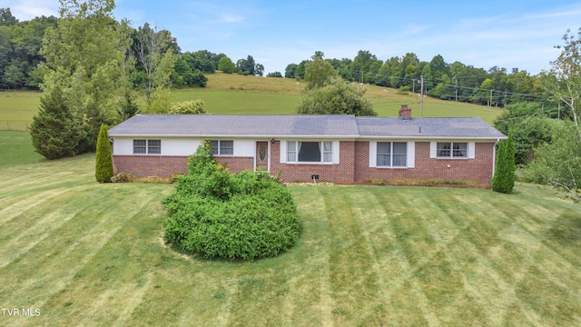 3054 Redbud Hwy, Honaker, VA 24260 - ranch-style home featuring a front lawn, a chimney, and brick siding