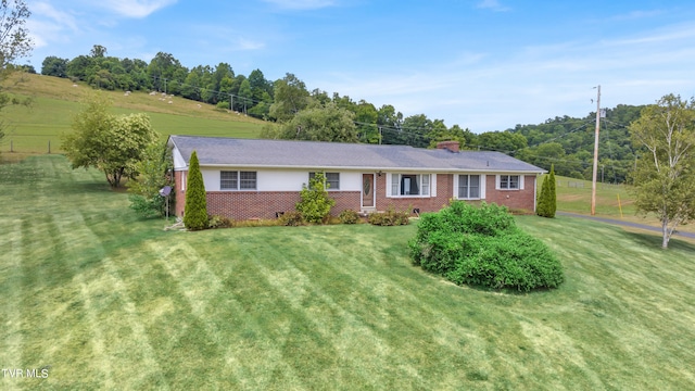 3054 Redbud Hwy, Honaker, VA 24260 - ranch-style home with a front lawn, brick siding, and a chimney