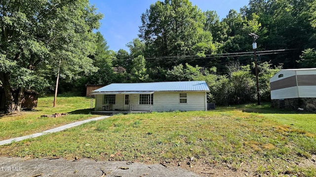 view of front of home with a front lawn and covered porch