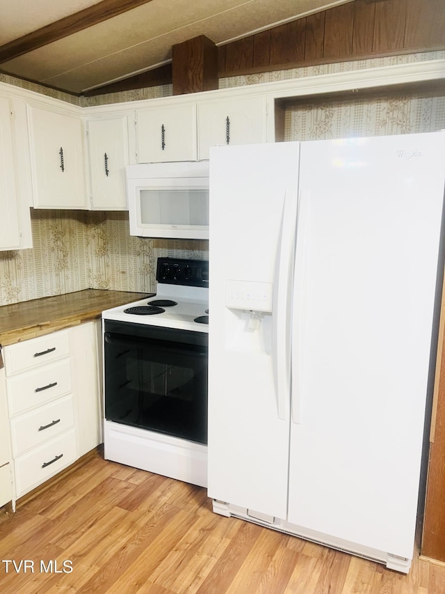 kitchen with wooden counters, white appliances, and white cabinetry