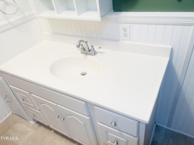 bathroom featuring tile patterned flooring and vanity