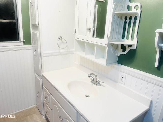 bathroom with tile patterned flooring and vanity