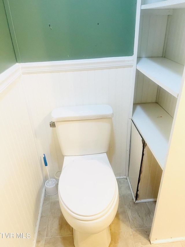 bathroom with tile patterned floors and toilet