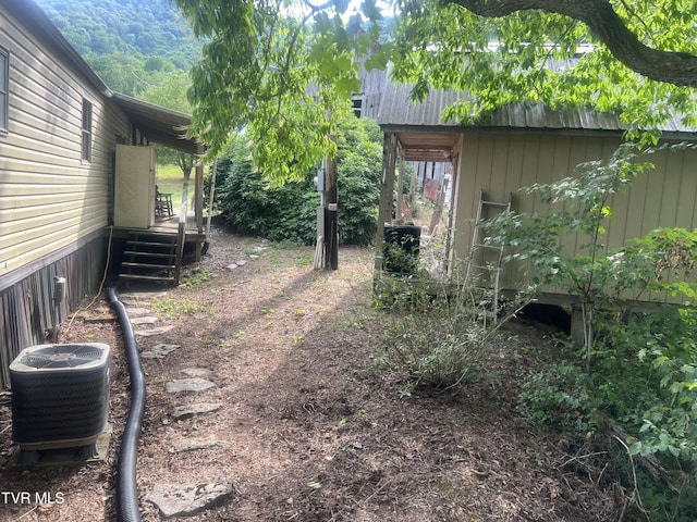 view of yard with central AC