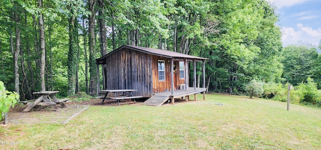 view of outbuilding with a lawn