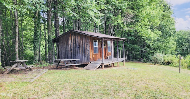 view of outdoor structure with a yard