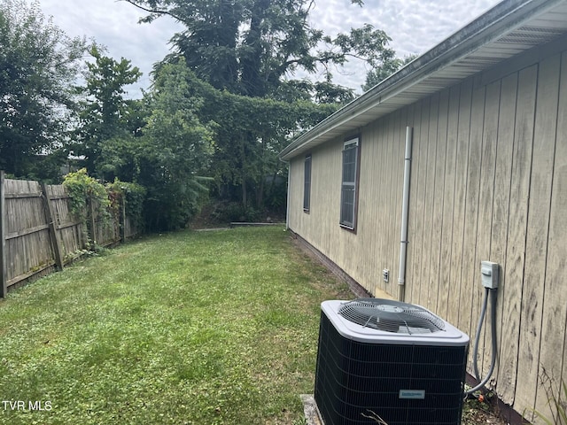 view of yard with central AC unit