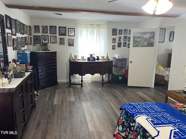 office space with dark wood-type flooring and a textured ceiling