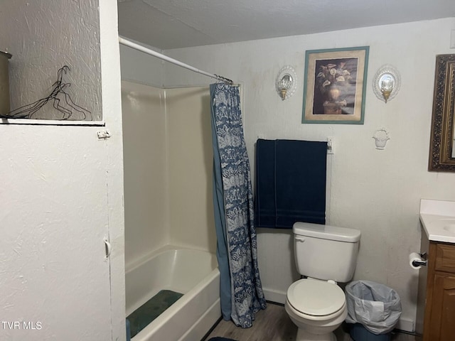 full bathroom with hardwood / wood-style floors, shower / bathtub combination with curtain, a textured ceiling, toilet, and vanity